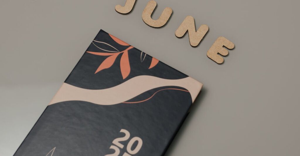A minimalist 2025 planner with 'June' wooden cut-out letters on a neutral background, ideal for planning and organization.